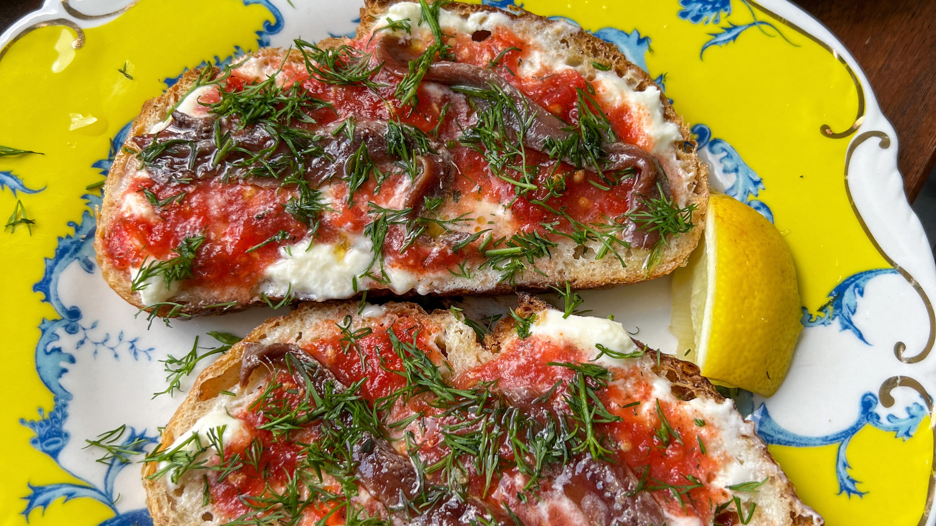 Bloody Mary Rimming Spice Grated Tomato Toast with Crème Fraîche, Anchovies, and Fresh Dill